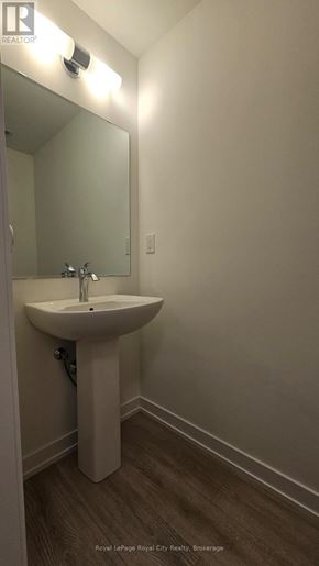 Guelph (Clairfields/Hanlon Business Park) townhouse for rent - A white pedestal sink in a small bathroom.
