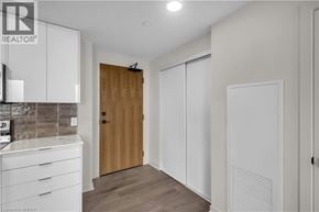 Brantford condo for rent - A realtor logo is on a glass door.