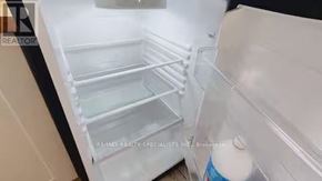 Hamilton (Crown Point) apartment for rent - Empty refrigerator with a water bottle on the door.