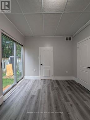 Barrie (Letitia Heights) townhouse for rent - A room with a grey floor and white walls.