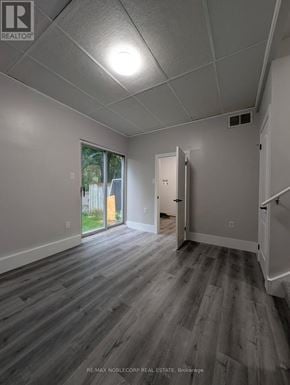 Barrie (Letitia Heights) townhouse for rent - A room with a grey floor and white walls.
