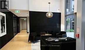 Milton (Tm Timberlea) apartment for rent - A black and white hallway with a fireplace and seating area.