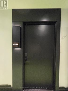 Milton (Tm Timberlea) apartment for rent - A black door with a sign that says 1305A on it.