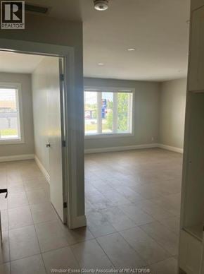 Windsor apartment for rent - A room with a doorway leading to a balcony.