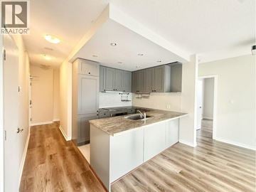 Vancouver apartment for rent - A kitchen with a sink and cabinets in a house.