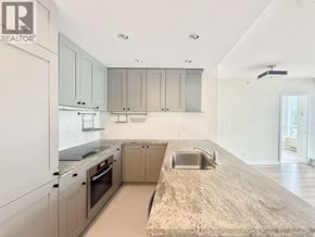 Vancouver apartment for rent - A kitchen with a sink and a refrigerator.