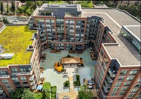 Vaughan (Crestwood-Springfarm-Yorkhill) condo for rent - A modern building complex with a courtyard and a fountain.