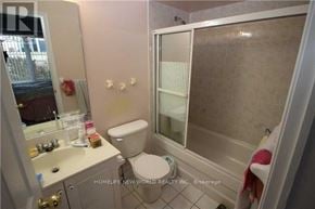 Markham (Commerce Valley) townhouse for rent - A bathroom with a toilet, sink, and shower.