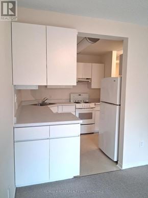 Pelham (Fenwick) apartment for rent - A kitchen with white appliances and cabinets.