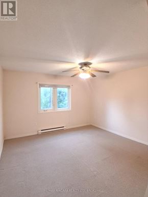 Pelham (Fenwick) apartment for rent - A room with a ceiling fan and a window.