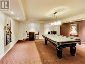 Toronto (Niagara) condo for rent - A pool table in a room with a poster on the wall.