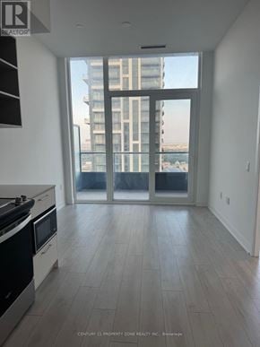 Brampton (Fletcher's Creek South) condo for rent - A kitchen with a stove top oven and a microwave.
