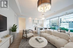Toronto (Annex) condo for rent - A living room with a white couch and a coffee table.