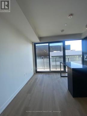 Hamilton (Beasley) condo for rent - A room with a large window and a wooden floor.