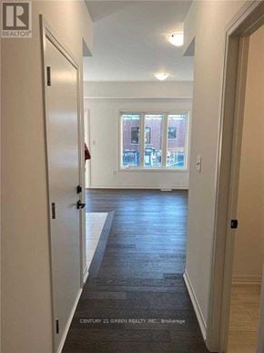 Barrie (Painswick South) townhouse for rent - A hallway with a door on the left and a window on the right.