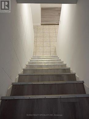Hamilton (Landsdale) triplex for rent - A set of stairs with a tiled floor leading to a doorway.