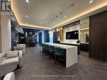 Vaughan (Concord) condo for rent - A modern living room with a long white table and chairs.
