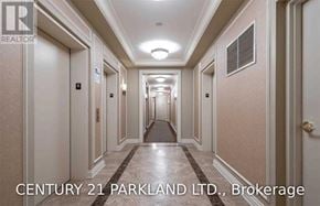 Vaughan (Maple) condo for rent - A hallway with marble floors and beige walls, with the text "CENTURY 21 PARKLAND LTD., Brokerage" at the bottom.