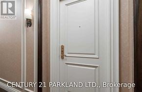 Vaughan (Maple) condo for rent - A white door with a brass handle is shown in the image.