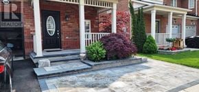 Milton (Ha Harrison) townhouse for rent - A brick house with a black door and a sign that says REALTOR.