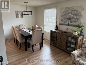 Waterloo apartment for rent - A dining room with a table set for six.