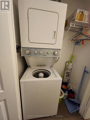 Markham (Milliken Mills East) condo for rent - A white washing machine with a white door and a white top is in a small room.