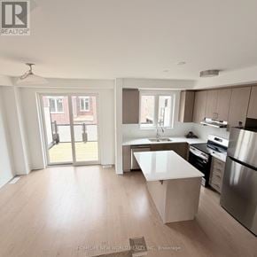 Markham townhouse for rent - A modern kitchen with a large island in the middle.