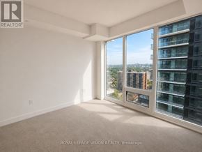 Toronto (Humber Heights) condo for rent - A room with a large window overlooking a cityscape.