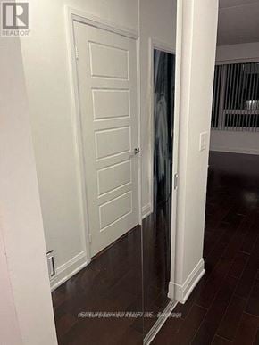 Markham (Unionville) condo for rent - A white door is in a room with a brown floor.