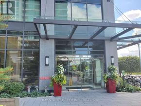 Mississauga (City Centre) condo for rent - The front of a building with a glass door and a sign that says "Bay Street Group, Brokerage".