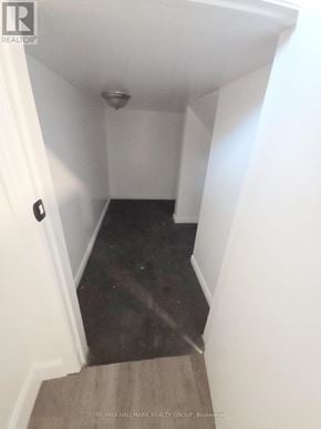 Casselman apartment for rent - A hallway with a carpeted floor and white walls.