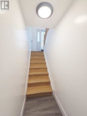Casselman apartment for rent - A hallway with a staircase leading to a door.