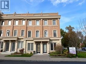 Toronto (Bridle Path-Sunnybrook-York Mills) townhouse for rent - A building with a sign that says "70 years" in front of it.