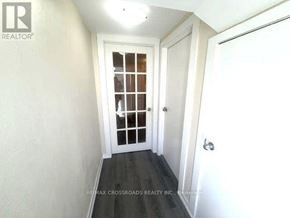 Toronto (Bendale) apartment for rent - A hallway with a door and a window.