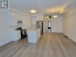 Markham (Middlefield) townhouse for rent - A realtor photo of a kitchen and living room with wood floors and white walls.