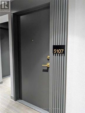 Vaughan (Vaughan Corporate Centre) condo for rent - A black door with a gold handle and a sign above it that says 5107.
