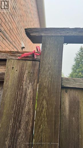 Markham (Middlefield) apartment for rent - A wooden fence with a red ribbon tied to it.