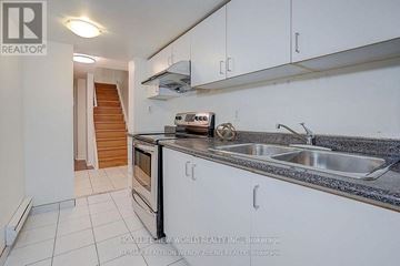 Markham (Middlefield) apartment for rent - A kitchen with white cabinets and a stainless steel sink.