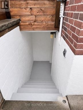 Toronto (Etobicoke West Mall) apartment for rent - A set of stairs leading to a basement.