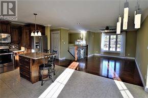 South River apartment for rent - A modern kitchen with a center island and a dining area.