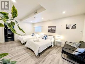 Hamilton (Crown Point) apartment for rent - A bedroom with two beds and a black chair.