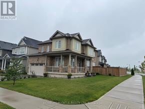 Hamilton (Binbrook) apartment for rent - A row of houses with a sidewalk in front of them.