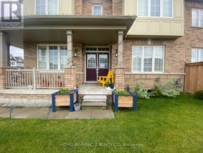 Hamilton (Binbrook) apartment for rent - A front porch with a bench and a planter box.