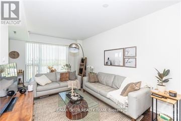 Ottawa condo for rent - A living room with a grey couch and a coffee table.