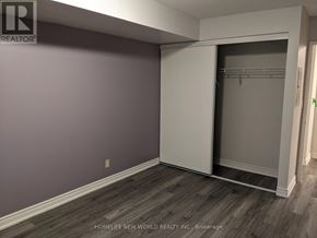 Toronto (Willowdale East) condo for rent - A room with a white closet and wooden floors.