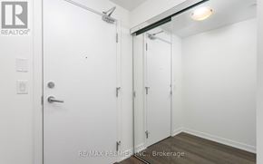 Toronto (High Park North) condo for rent - A white door with a handle and a lock is on the left side of the image.