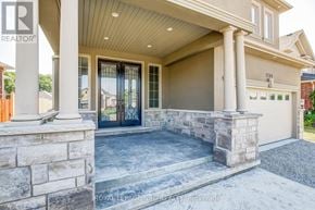 Niagara Falls (Forestview) apartment for rent - A house with a stone pillar and a glass door.