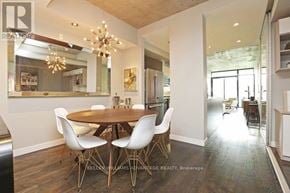 Toronto (Niagara) condo for rent - A dining room with a round table and chairs.