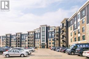 Milton (Be Beaty) condo for rent - A parking lot with cars and a building in the background.