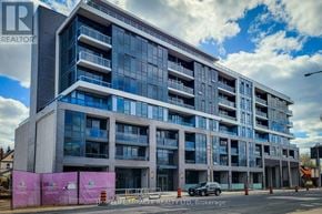 Hamilton (Kirkendall) house for rent - A large building with many windows and balconies is under construction with a sign that reads "HOMELIFE/MIRACLE REALTY LTD, Brokerage".